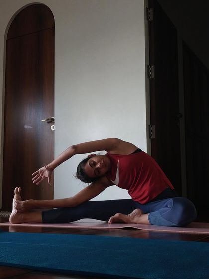 When the week feels like a blur, take a moment to slow down with a deep side bend like Parivrtta Janu Sirsasana (Revolved Head-to-Knee Pose).