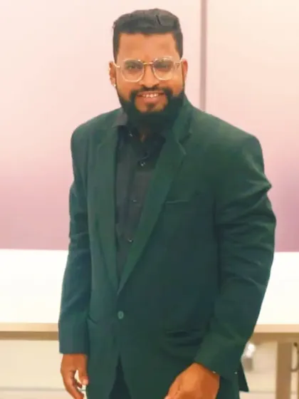 A confident pose in a smart blazer. This is the look of someone who is serious about the art of entertainment, ready to bring a professional touch to your event.