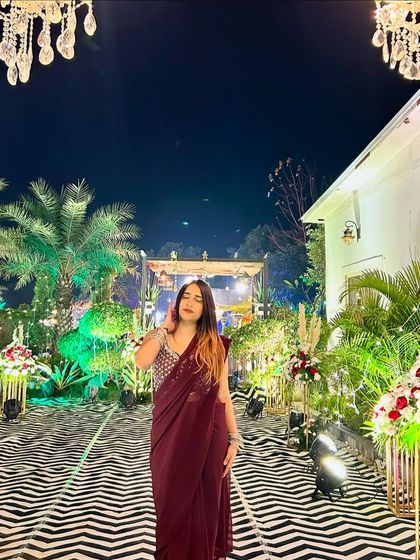A thoughtful pose in the saree, looking away from the camera. This creates a more artistic and editorial vibe.