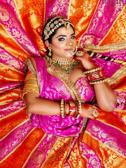 This stunning top-down shot captures the full splendor of the bridal lehenga and the radiant makeup, a key shot for any professional portfolio.