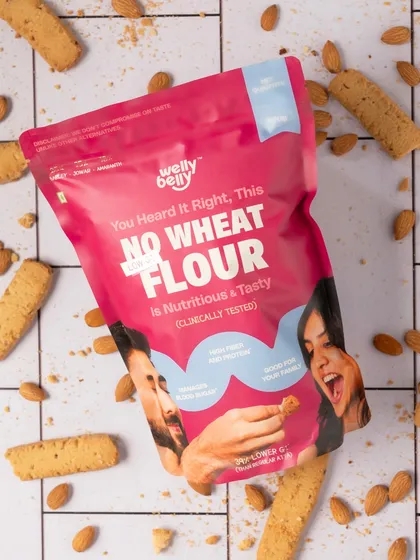 A creative flatlay for Welly Belly's No Wheat Flour. Surrounding the package with the final product (almond biscuits) tells the story of what you can create, making it more than just a bag of flour.