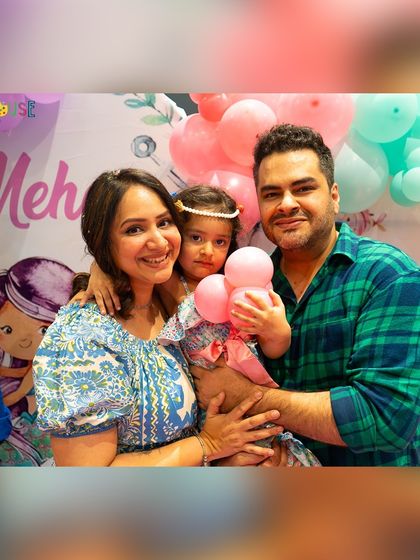 A happy family photo from Meher's mermaid-themed birthday. I make sure the whole family feels part of the celebration.