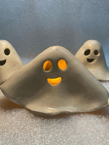 Another angle of the ghost tea light, showing how the light flickers through its eyes and mouth.