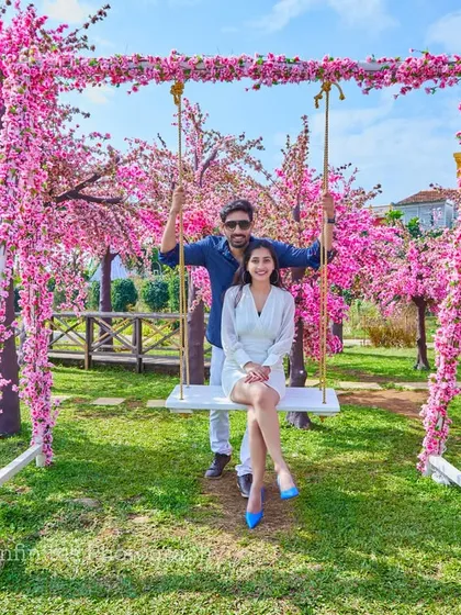 A fun and playful shot on our cherry blossom swing set, perfect for capturing the happy and carefree side of your relationship.