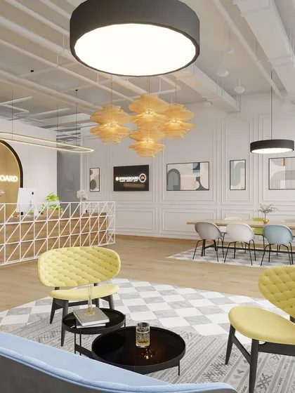 A comfortable lounge seating arrangement in the reception area. The use of colorful, contemporary furniture against a backdrop of classic architectural details creates a stylish and eclectic mix.