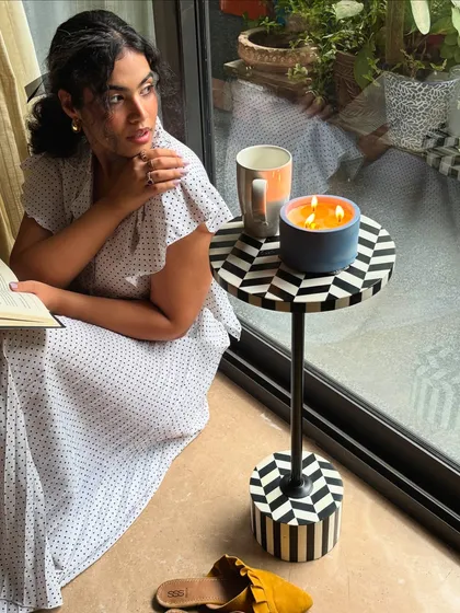Naval Ravikant is the only man she’s into right now. A quiet, cozy moment at home, reading by the window on a rainy day. Even my at-home outfits are chic, like this polka dot dress.