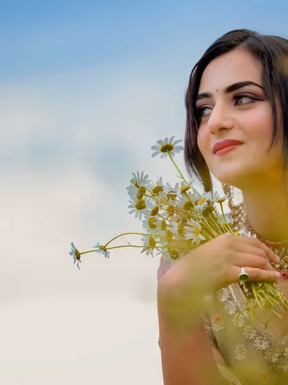 An artistic shot with foreground blur, creating a dreamy and romantic portrait for the music video.