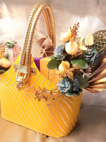 Another view of our festive yellow basket hamper. The elegant design and rich contents make it a wonderful gift for corporate clients, friends, or family.