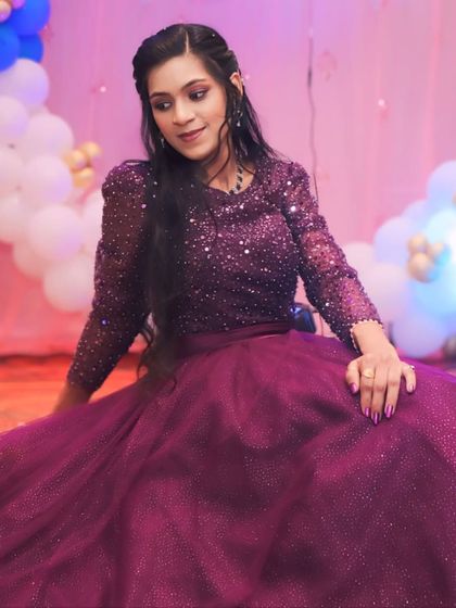 A dreamy pose in a sparkling purple gown. This dress is perfect for making a wish and celebrating another year in style.
