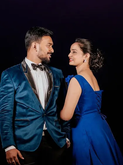 Capture your connection with an elegant couple's photoshoot. My studio's dramatic black backdrop makes colors pop and creates a timeless, intimate portrait perfect for pre-wedding memories.
