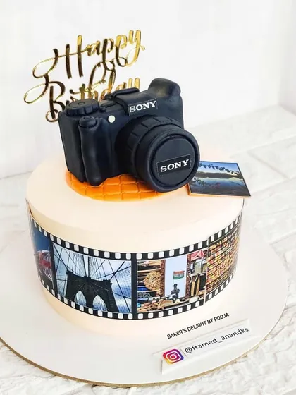 A special creation for a photography enthusiast. This cake features a hand-sculpted, realistic Sony camera topper and an edible film strip around the side showcasing the photographer's own beautiful pictures.