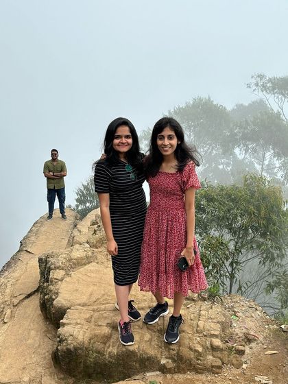 Two friends at Dolphin's Nose, with a photobomber in the background!
