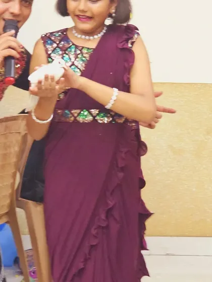 The birthday girl proudly holds the magic dove. These interactive moments make the birthday child feel extra special.