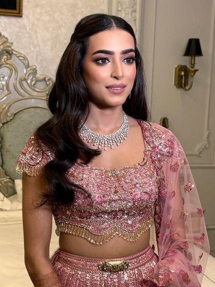 Another portrait of the bride, her half-up hairstyle complementing her delicate features.