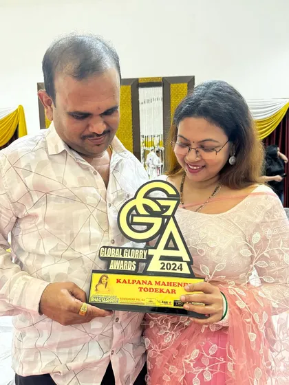 Sharing a happy moment with my husband and my Global Glory Award. His support has been instrumental in my journey as an entrepreneur and artist.
