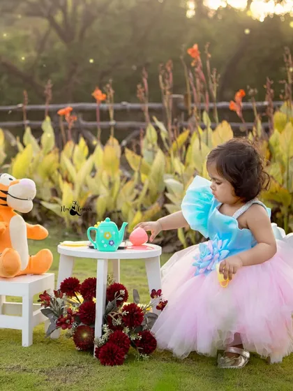 Sharing a cup of tea with Tigger. These playful, interactive moments create the most authentic and joyful birthday portraits.