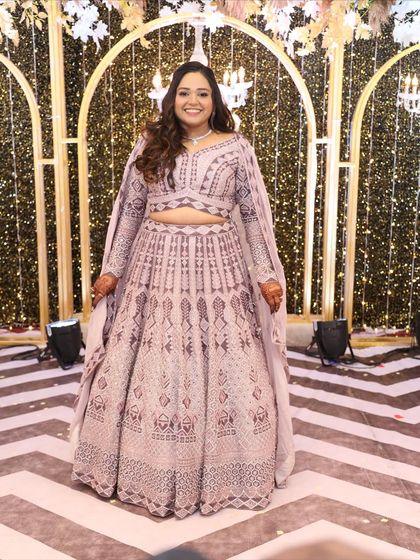 Elegance meets shimmer for this Sangeet look. The makeup is all about glow, glam, and grace, creating a radiant look that's perfect for the dance floor.