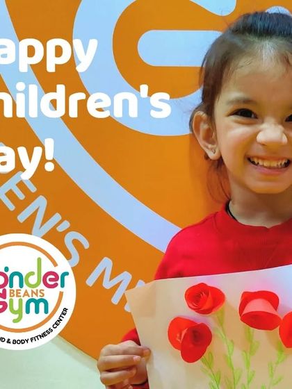 Every child is a unique flower, and we love watching them bloom. This happy student holding her 3D flower art perfectly captures the joy and pride we nurture in our classes.