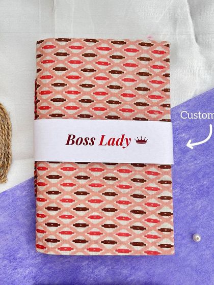 A close-up of our "Boss Lady" journal. The cover is made from handmade paper with a beautiful block print design, and we can customize the label for you.