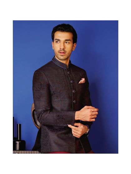 A classic navy bandhgala jacket with a subtle texture. This piece is a versatile staple, perfect for creating a look of timeless sophistication for any formal event.