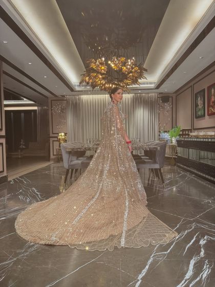 A wide shot showing the magnificent trail of the lehenga. This look was designed to make a grand statement from every angle.