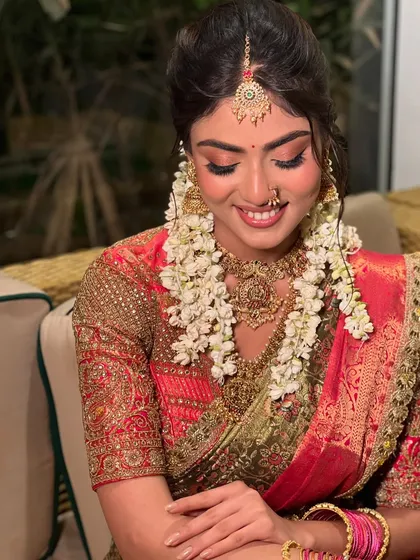 Stunningly beautiful. This bride is adorned with fresh jasmine garlands (gajra), a classic element of the South Indian bridal look.
