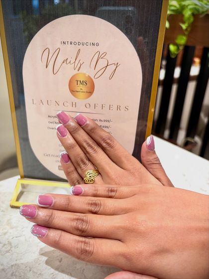 Another shot of the mauve and glitter French manicure, showing off its sparkle. This design is a client favorite for a reason.