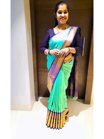 Here is a client looking elegant in a sea-green silk saree I draped for her. My techniques ensure a flattering fit for every body type, giving you confidence for any occasion.