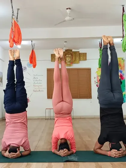 The collective energy of a group moving and breathing together is powerful. This synchronized Sirsasana (Headstand) showcases the focus, strength, and sense of community that you will build during the teacher training course with your fellow students.