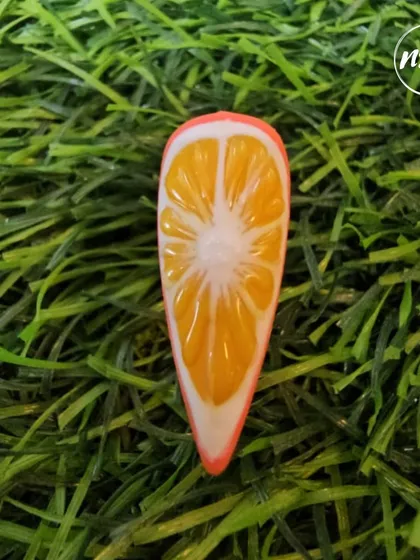 How realistic is this orange slice nail art? This incredibly detailed and juicy-looking design was created by one of our students, showcasing their advanced 3D gel skills.