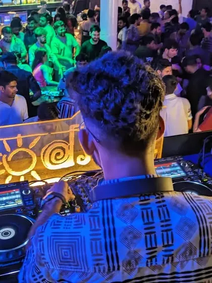 The dance floor is packed and the energy is high. This over-the-shoulder view shows my perspective as I control the music for a full house at Cafe Mambo.