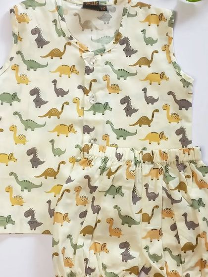 A cute dinosaur print jhabla and bloomer set. The earthy tones and fun pattern make it a great choice for little adventurers.