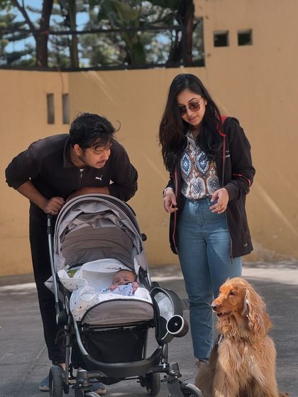 A candid moment from our New Year's photoshoot, with dad and baby sharing a look.