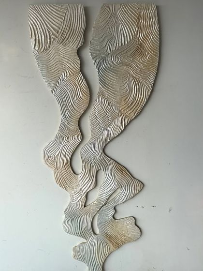 "Whispering Waves," a piece where flowing forms are carved in rhythm. This is where structure meets soul and stillness begins to move. It is made with texture paste on wood.