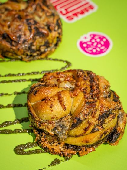 Say hello to our Pesto Cheese Braid. The pesto is made in-house with Kashmiri walnuts, braided into soft dough, and finished with good old Amul cheese.