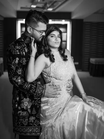 A stylish and moody black and white portrait from an engagement shoot. This shot has a classic, glamorous feel, perfect for celebrating this special milestone.