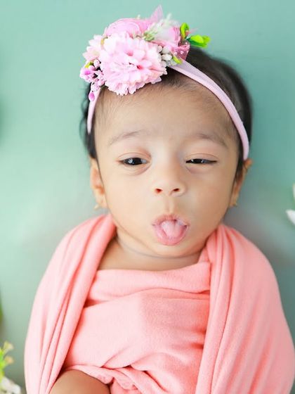 A tiny tongue-out expression. These quirky, fleeting moments are so precious and add so much character to a baby's first gallery.