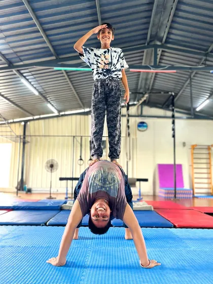 Fitness should bring you joy. Our partner acrobatics classes are filled with laughter and support, proving that building strength and balance is more fun with a friend.