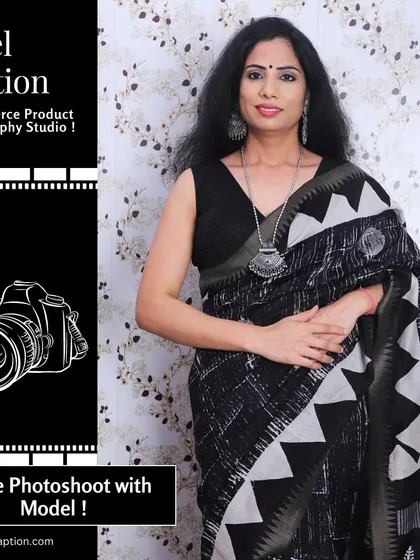 A close-up portrait of a model wearing a beautiful black and white cotton saree and traditional jewelry. This shot focuses on the drape and how the saree complements the wearer.