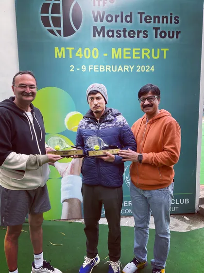 Receiving the doubles trophy at the MT400 in Meerut. Teamwork and strategy are crucial for doubles success.