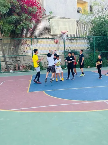 Players battle for a rebound. We teach the importance of boxing out and being aggressive.