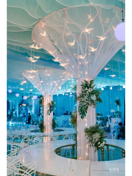 The seating area was designed to feel like being underwater, with flowing ceiling drapes and pillars adorned with lights and hanging bird-like figures, creating a magical, ethereal glow.