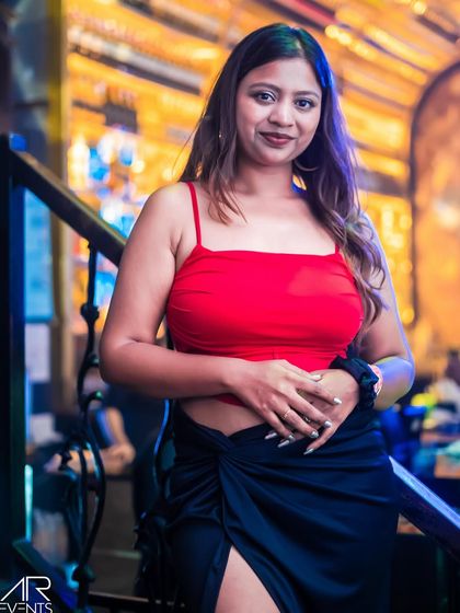 A guest in a stylish red crop top.