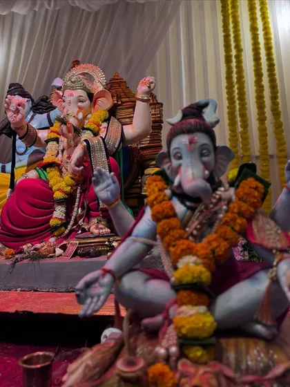 This photo captures the two main idols at the 'Gokul Nagari Cha Maharaja' event, showing how the space was effectively organized to accommodate them both.