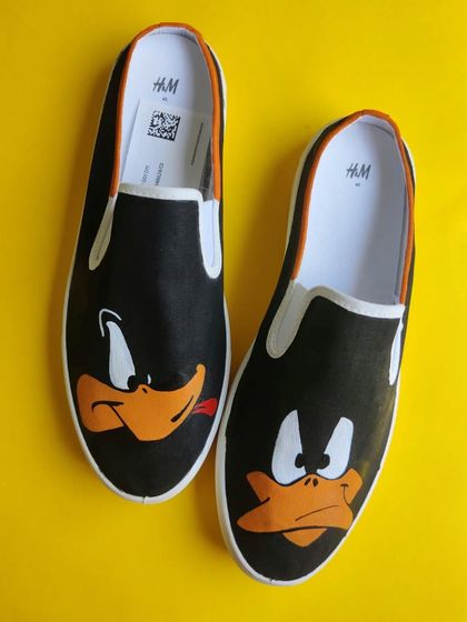 Quack off! These H&M slip-ons feature the two moods of Daffy Duck. It's a simple, fun design on a canvas shoe, showing that I can work with different materials to bring your ideas to life.