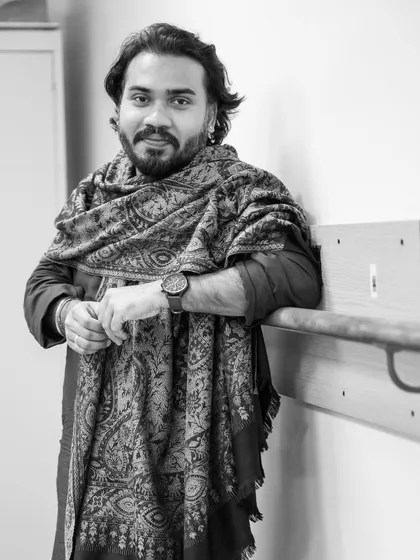 A portrait taken backstage. The moments before stepping onto the stage are filled with a mix of anticipation, prayer, and focus.