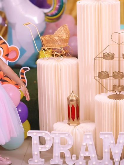 A vibrant 'Super Mario' themed birthday party, with character cutouts, a custom backdrop of the Mushroom Kingdom, and red and green balloons, ready for an adventure.