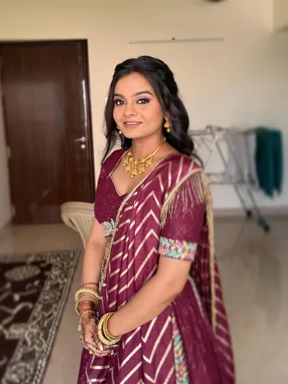 This bride is all smiles for her engagement. Her makeup is clean and radiant, with a focus on enhancing her natural features to create a fresh and youthful glow.