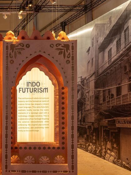 The entrance to the 'Indofuturism' installation, where an ornate archway frames the narrative of the theme. The design celebrates heritage while embracing external interpretations, positioning a new vision of India on the world stage.