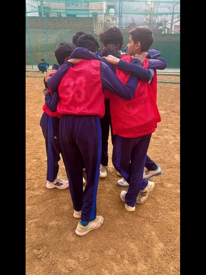 The team breaks the huddle, ready to give their all on the field.